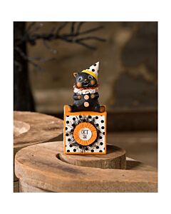 Party Hat Kitty on Block by Bethany Lowe features a sweet hand-painted resin kitten wearing a festive party hat. The kitten sits on a decorative block adorned with printed paper, crepe paper, and tinsel, adding a charming touch to your Halloween decor.
