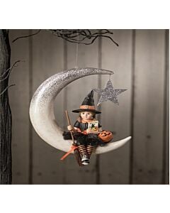Hand-painted Halloween ornament featuring a whimsical witch named Fraya seated atop a silver-glittered crescent moon, adorned with a dangling star. Fraya wears a black tutu with silver sparkles, orange and black striped leggings, and holds a broom, Jack O