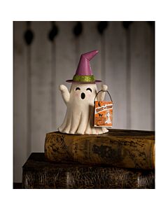 Figurine by Bethany Lowe featuring a cute witchy ghost with a treat bag, made from hand-painted resin, glitter, wire, and paper. Can be used with a tea light to illuminate its eyes and mouth. Perfect for vintage-inspired Halloween decor.