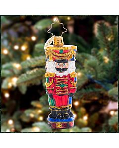 The Three Nutty Knights Gem ornament showcases a trio of colorful nutcrackers clad in red, blue, and green, standing proudly in festive formation. Their regal uniforms and bright expressions bring a touch of classic charm and cheerful protection to any ho