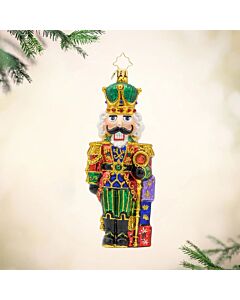 The Yuletide Sentinel ornament stands proudly with a sparkling coat, ready to guide holiday adventures. Its brave expression and festive charm make it a striking companion for the season.