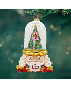 A Limited Edition Christopher Radko ornament featuring the Enchanted Guard, a delicate ballerina brought to life in a winter wonderland. This collectible captures the magic of twirling snow and sparkling lights, creating a festive, dreamy holiday scene.