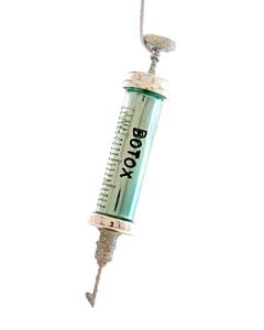 Wrinkle Free ornament features a playful beauty-themed design inspired by cosmetic treatments with a humorous twist. This Cody Foster & Co collectible adds clever conversation-starting charm and whimsical personality to your holiday ornament collection.