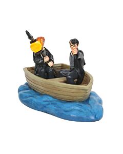 Miniature scene of young Harry Potter and Ron Weasley riding together in a small wooden boat on their way to Hogwarts for the first time.