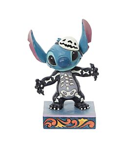 This image features a glow-in-the-dark Jim Shore bust, where Stitch the alien dons a spooky skeleton costume with an endearing smile and lovable eyes designed to charm Disney fans. The collectible captures a playful blend of eerie enchantment and sweet wh