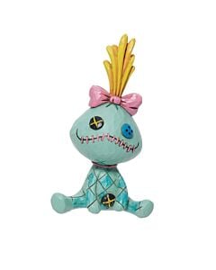 Whimsical Jim Shore Scrump figurine with stitched details and mismatched button eyes, capturing Lilo’s beloved handmade doll. This charming Disney collectible blends rustic folk-art patterns with playful personality, perfect for fans of Lilo & Stitch