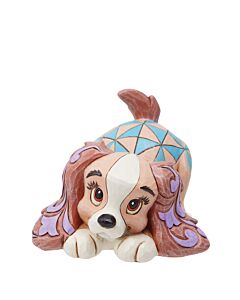 This charming miniature figurine captures the elegance of Lady from Disney's Lady and the Tramp. Adorned in Jim Shore's signature rosemale and patchwork style, it brings a touch of Disney magic to any collection.