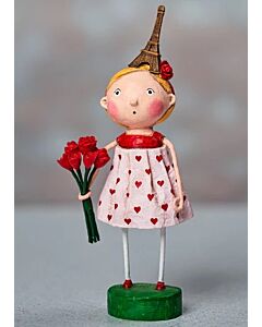 The ESC and Co. From Paris with Love figurine by Lori C. Mitchell features a charming girl holding flowers while wearing a whimsical Eiffel Tower hat. This playful collectible captures the romance and delight of Parisian-inspired style.