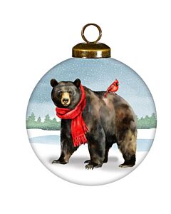 A cheerful black bear wears a red scarf, standing in a snowy landscape accompanied by a bright red robin. This festive ornament captures the cozy spirit of a woodland Christmas scene.
