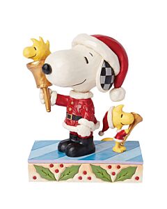 Jim Shore Heartwood Creek figurine showing Snoopy in Santa suit ringing a bell while Woodstock in a matching outfit plays a horn, spreading Christmas cheer; a joyful Woodstock sibling peeks from inside the bell