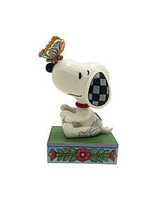 Amidst a bloom of spring flowers, Snoopy enjoys a serene moment as a intricately painted butterfly rests on his nose, capturing the essence of friendship and tranquility