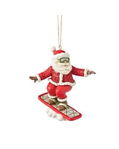 A daring Santa ornament carves down an imaginary slope on his snowboard, complete with shades and a festive coat. His dynamic pose and swirling details bring the excitement of winter sports into holiday decorating.