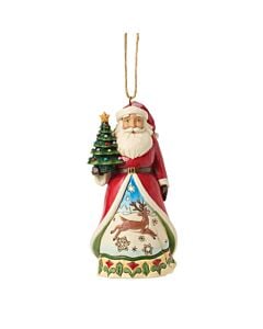 A whimsical Santa ornament holds a miniature tree and gifts, his cloak opening to reveal a serene winter scene. A playful reindeer prances through the snow, capturing the magic and joy of the holiday season.