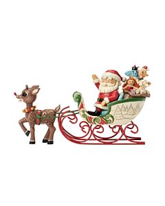 Jim Shore figurine: Rudolph's holly-inspired rosemaling and Santa's wave bring the Christmas spirit to life as he pulls the sleigh carrying misfit toys.