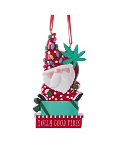 Jolly gnome figure donning a sparkly hat and clutching a glittered cannabis leaf, perched on a personalized present, perfect for cannabis enthusiasts and those who appreciate unique, handmade touches