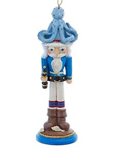 This Hollywood Nutcracker ornament wears a whimsical octopus hat, blending nautical charm with festive flair. Its playful design adds a unique and joyful touch to any holiday tree or décor.