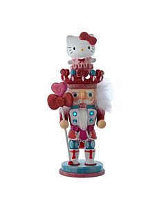 The Hello Kitty Hollywood Nutcracker blends the classic holiday nutcracker design with the playful charm of the iconic Sanrio character. This Kurt Adler collectible brings a whimsical and festive twist to traditional Christmas décor.