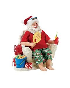 This festive Santa figurine captures the essence of a perfect beach vacation, complete with a comfy chair, a refreshing drink, and a bucket of tempting salt water taffy. It's a delightful depiction of Santa enjoying some well-deserved relaxation, embodyin