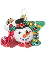 A cheerful snowman proudly displays the word "JOY" in bright festive letters, embodying the spirit of the season. His delighted expression and holiday accents bring a touch of celebration to any Christmas display.