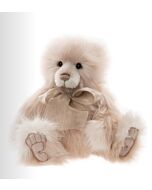Charlie Bears Donna plush bear with soft lavender and white fur, sculpted paw pads, and a silky lavender bow around her neck