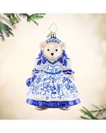 The 'Chinoiserie Muffy' ornament features a festive Muffy dressed in an outfit with intricate Chinoiserie patterns, blending cultural elegance with holiday cheer. This charming decoration adds a touch of artistic flair to your holiday tree.