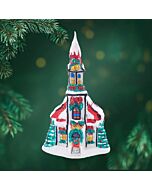 A charming chapel adorned with festive bells and nestled in snowy branches, this ornament brings a touch of holiday cheer to your tree. Its intricate details and joyful spirit make it a cherished addition to your seasonal decor.