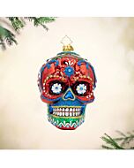 The Calavera Fiesta ornament bursts with vibrant colors and playful skull details, bringing a lively twist to spooky season décor. Its festive design adds whimsical charm, making it a standout on any holiday tree.