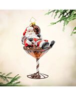 Santa’s Merry Martini Brew ornament featuring Santa lounging in a festive espresso martini for a whimsical holiday twist. This playful decoration adds a cheerful and spirited touch to any Christmas tree display.