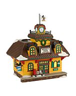 Vintage-style train station with Mickey-themed elements, decorated for the holidays and ready to welcome passengers.
