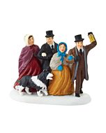 Department 56 Joyful Carols New England Village collectible features a group of carolers carrying a lantern while a friendly collie joins their holiday celebration. This festive scene adds music, warmth, and traditional Christmas village charm to displays