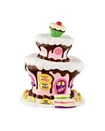 Layered, cake-like building with pastel tones and candy-themed accents, evoking the joyful sweetness of a Who-ville holiday treat.