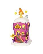 Colorful, whimsical boutique building with curving lines and playful details, representing the vibrant source of Who-ville’s eccentric hairstyles.
