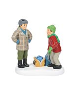 Ralphie’s father proudly holds a bright blue bowling ball, beaming with excitement in a playful village winter scene.