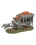 A ghostly black horse hitched to an antique-style hearse, evoking the spooky charm of the Haunted Mansion exterior at Disneyland.