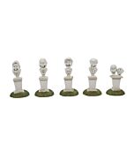 A group of five animated busts with expressive singing faces, including one with a broken head, recreating the Grim Grinning Ghosts scene from the Haunted Mansion graveyard.