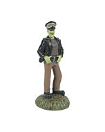 Whimsical miniature figure of Herman Munster dressed for driving.