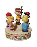 This Jim Shore figurine depicts the Peanuts gang caroling around Charlie Brown’s iconic little Christmas tree, spreading holiday cheer. Hand-painted in folk art style, it captures the warmth, love, and charm of the classic Christmas special.