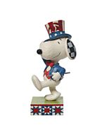 This Jim Shore figurine shows Snoopy dressed as Uncle Sam, marching proudly with patriotic spirit. Handcrafted with folk art detail, it celebrates both his American roots and the timeless charm of the Peanuts comic strip.
