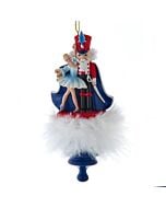 A festive Kurt Adler ornament featuring the Nutcracker Prince and Clara, with Clara wearing a charming holly-adorned hat. This collectible captures the magic of the Nutcracker ballet in vibrant colors and intricate holiday detail.