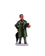 A hand-painted figurine of a preacher, complete with a Bible, overcoat, and umbrella, capturing the essence of a bygone era.