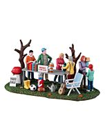 The Lemax Neighborhood Yard Sale accessory depicts cheerful figures browsing treasures in a lively community scene. Perfect for village displays, it adds everyday charm and storytelling detail to a bustling neighborhood setting.