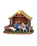 A serene Lemax Nativity Scene, intricately detailed with the holy family cradled within a rustic stable, accompanied by peaceful sheep