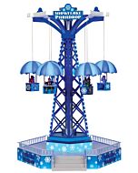 A whimsical blue and white carnival parachute ride, adorned with snowflakes, captures the excitement of a festive holiday fair