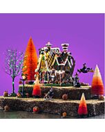 Complete Candy Witch Cottage set by Lemax, including witches, candy corn trees, and jack o' lanterns, evoking a terrifying yet alluring enchanted forest scene where sugary lures hide dark enchantments and escape demands cunning bravery.