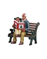 A heartwarming scene of a grandfather sharing a Christmas story with his granddaughter on a park bench.
