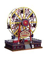 A festive Lemax "The Giant Wheel" collectible in action, with the Ferris wheel gracefully revolving and its vibrant lights flashing on and off, bringing carnival joy to your display.