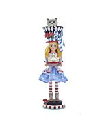 Elegant Alice-inspired nutcracker holding a tea set, topped with a black-and-white diamond patterned hat featuring Cheshire Cat peeking out, capturing the playful spirit of Wonderland.