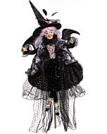 This Mark Roberts "Scandalous Witch" collectible features an elaborately dressed witch with vibrant purple hair, exuding a magical and slightly mischievous aura. The detailed craftsmanship showcases the enchanting quality of this unique Halloween figurine