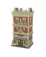 Classic brick building with striped awning and double doors, representing an upscale city chess club with historical charm.